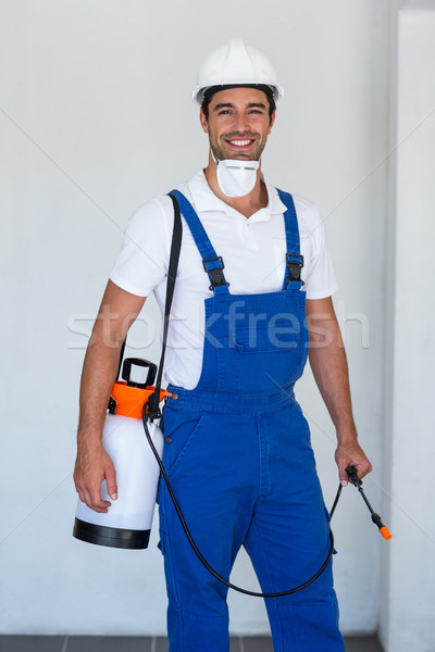 Portrait of happy manual worker with insecticide Stock photo © wavebreak_media