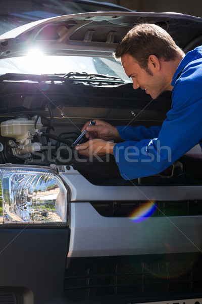 Mechanic examining the car Stock photo © wavebreak_media