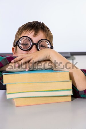 Portrait of schoolkid pretending to be a teacher in classroom Stock photo © wavebreak_media