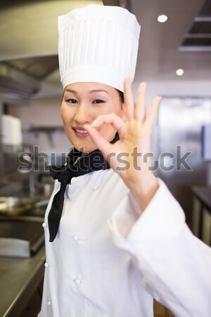 Smiling young woman preparing her bubble bath Stock photo © wavebreak_media