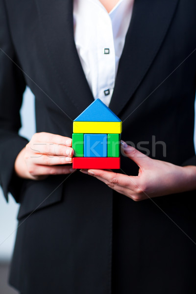 Woman holding a house  Stock photo © wavebreak_media