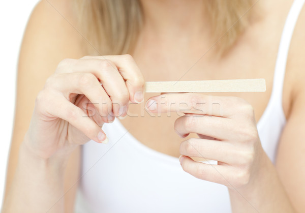 Portrait of a bright woman filing her nails Stock photo © wavebreak_media