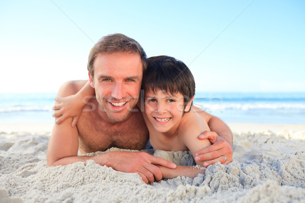 Father and his son at the beach Stock photo © wavebreak_media