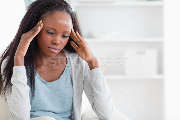 Young woman experiencing a headache Stock photo © wavebreak_media