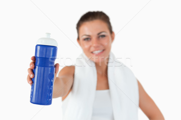 Sip of water being offered by young female against a white background Stock photo © wavebreak_media