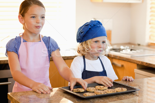 Stock photo: Happy siblings enjoying cookies together
