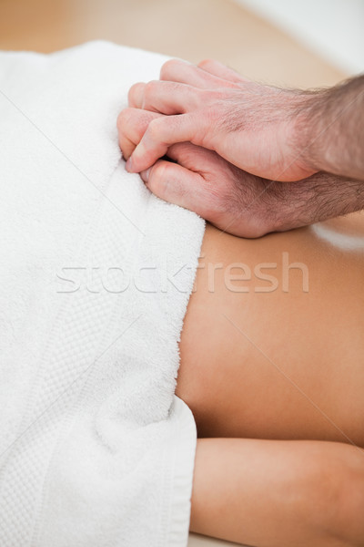 Close-up of doctor massaging the back of his patient in a room Stock photo © wavebreak_media