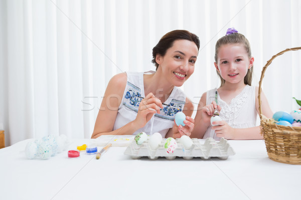 Mother and daughter painting easter eggs Stock photo © wavebreak_media