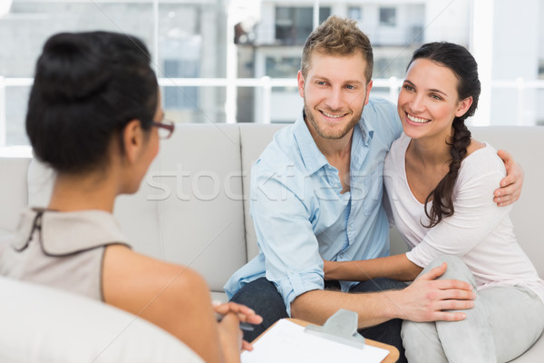 Smiling couple reconciling at therapy session Stock photo © wavebreak_media