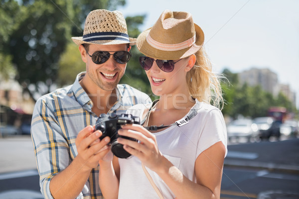 Hip young couple looking at their camera Stock photo © wavebreak_media