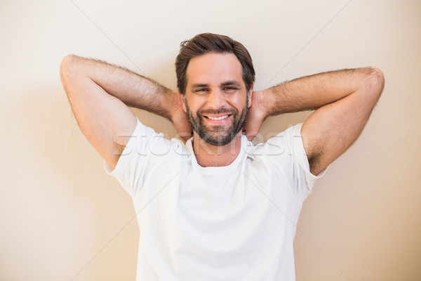 Happy man sitting on floor Stock photo © wavebreak_media