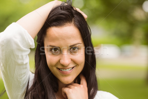 Stock photo: Happy brunette posing and looking at camera 