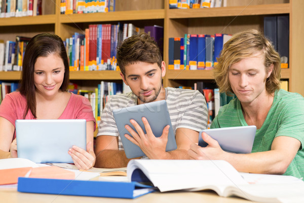 College students using digital tablets in library Stock photo © wavebreak_media