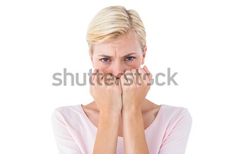 Stock photo: Anxious blonde woman looking at camera