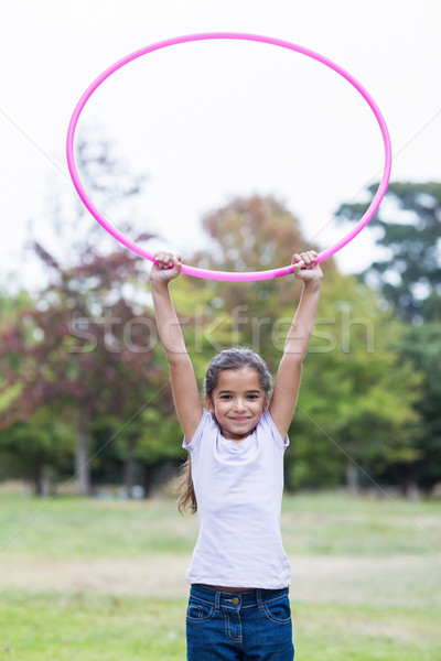 happy girl playing with hula hoops Stock photo © wavebreak_media