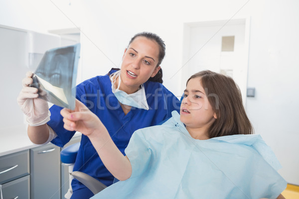 Pediatric dentist explaining to young patient the x-ray Stock photo © wavebreak_media