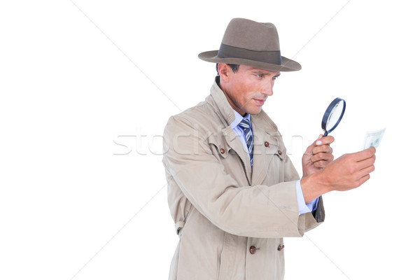Spy looking through magnifier Stock photo © wavebreak_media