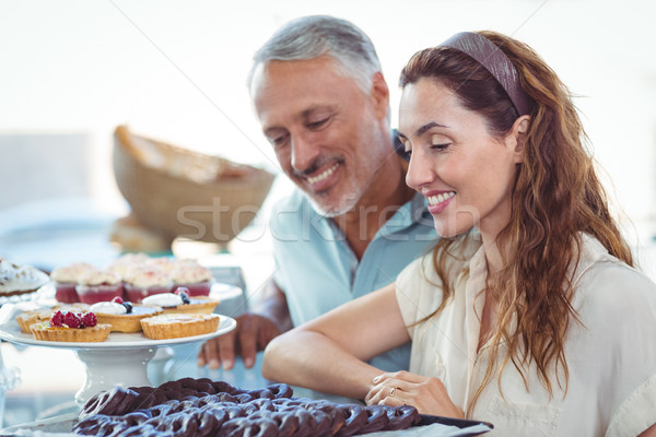 Cute couple looking at pastries Stock photo © wavebreak_media