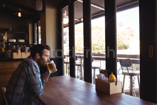 Thoughtful man having beer Stock photo © wavebreak_media