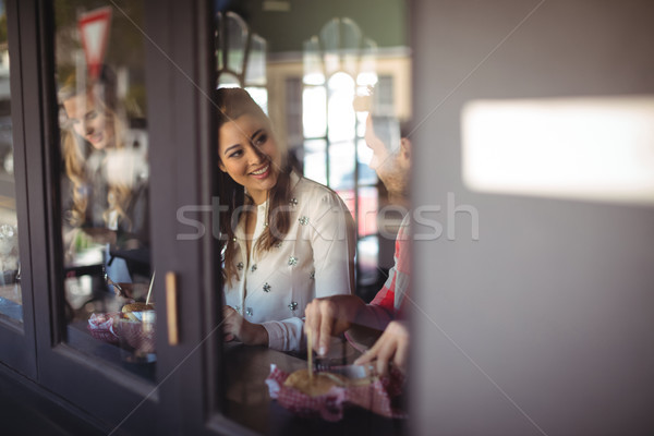 Stock photo: Friends having burger together