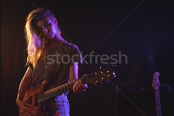 Confident female guitarist performing in concert Stock photo © wavebreak_media