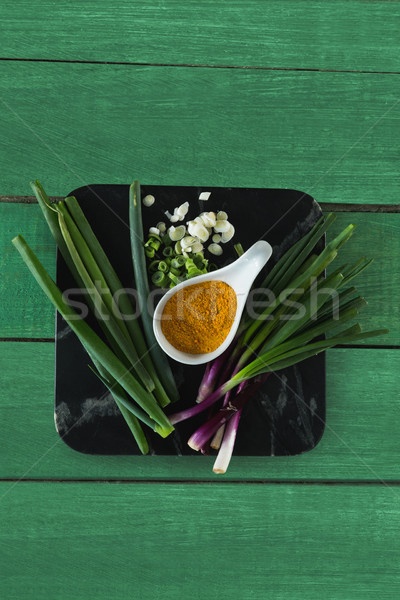 Scallions and turmeric on board Stock photo © wavebreak_media