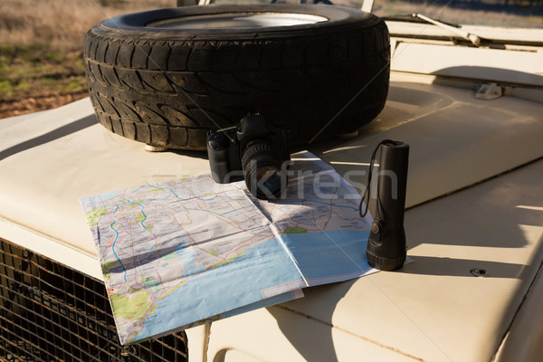 Spare tire with map on vehicle hood Stock photo © wavebreak_media