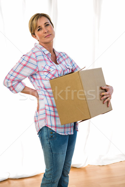 Woman holding a box Stock photo © wavebreak_media