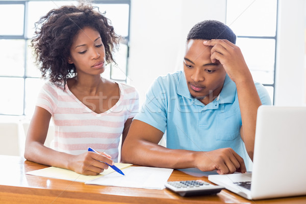 Worried young couple discussing bills Stock photo © wavebreak_media