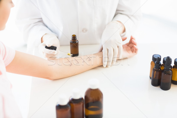 Midsection of doctor dropping medicine on patient hand Stock photo © wavebreak_media