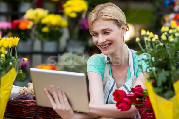 Female florist using digital tablet in florist shop Stock photo © wavebreak_media