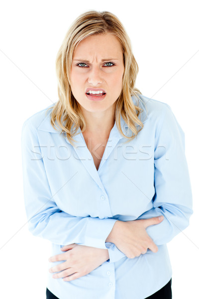 Depressed businesswoman with stomachache against white background Stock photo © wavebreak_media