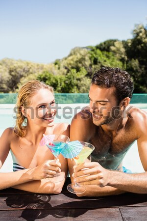 Belo casal potável cocktails piscina mulher Foto stock © wavebreak_media