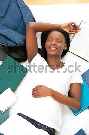 Smiling woman looking down on placeholder on white background Stock photo © wavebreak_media