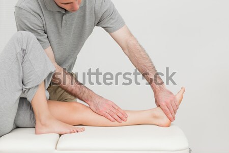 Calf of a patient being stretched by a doctor in a room Stock photo © wavebreak_media