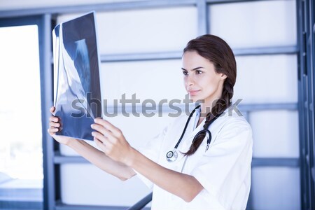Stock photo: Doctor analysing x-ray in hospital