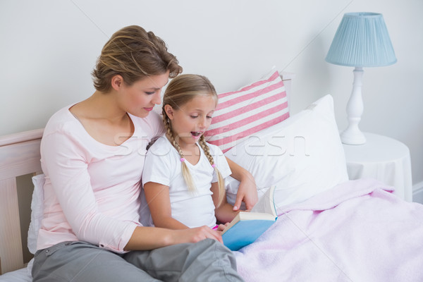 Mother with her daughter at bedtime Stock photo © wavebreak_media