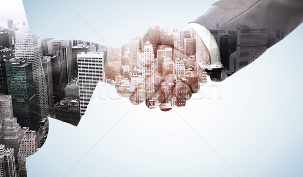 Composite image of handshake between two business people Stock photo © wavebreak_media