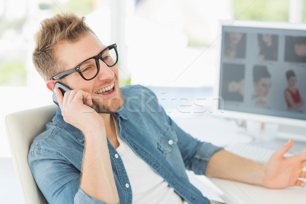 Editor talking on the phone at his desk Stock photo © wavebreak_media