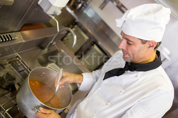 Concentrated chef preparing food in the kitchen Stock photo © wavebreak_media