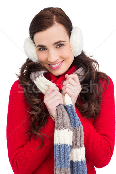 Happy brunette in winter clothes smiling at camera  Stock photo © wavebreak_media
