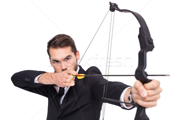 Smart businessman practicing archery looking at camera Stock photo © wavebreak_media