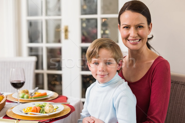 Portrait of mother with her son sitting on lap Stock photo © wavebreak_media