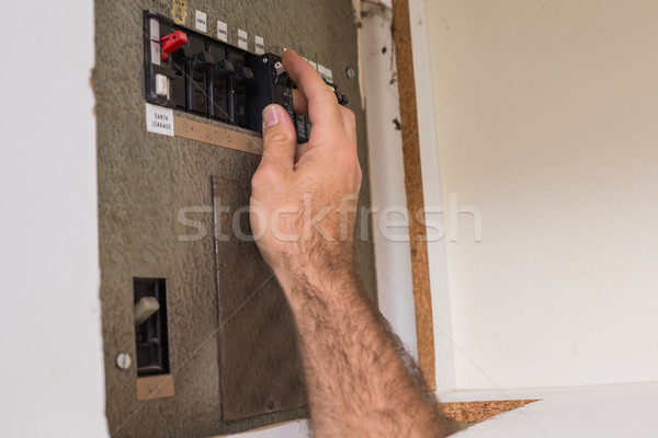 Electrician working on the fuse box Stock photo © wavebreak_media