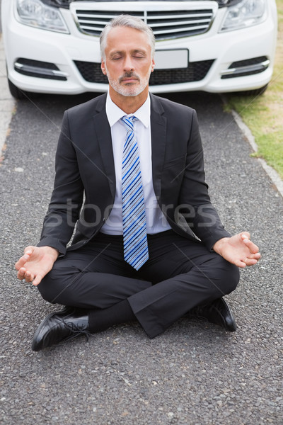 Businessman meditating after his car broken down Stock photo © wavebreak_media