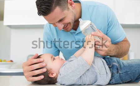 Homem bonito relaxante cama bebida quente casa quarto Foto stock © wavebreak_media