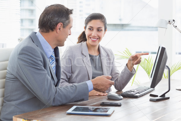 Businesswoman working with team mate Stock photo © wavebreak_media