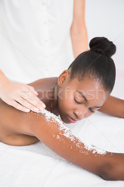 Pretty woman enjoying an exfoliation massage Stock photo © wavebreak_media