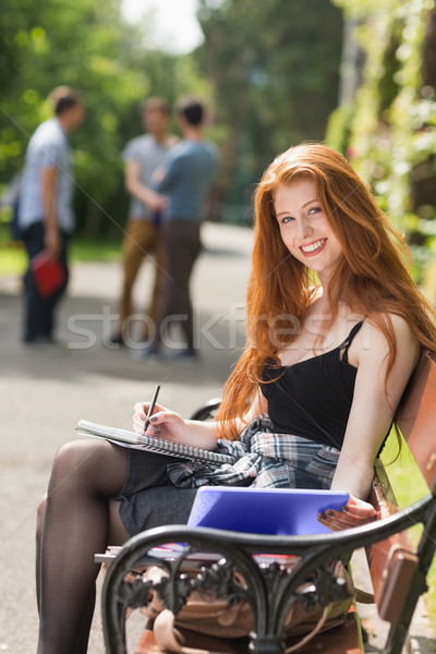 Pretty student studying outside on campus Stock photo © wavebreak_media