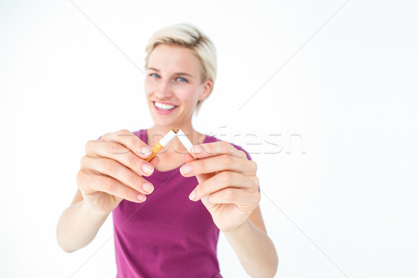 Pretty blonde breaking cigarette Stock photo © wavebreak_media